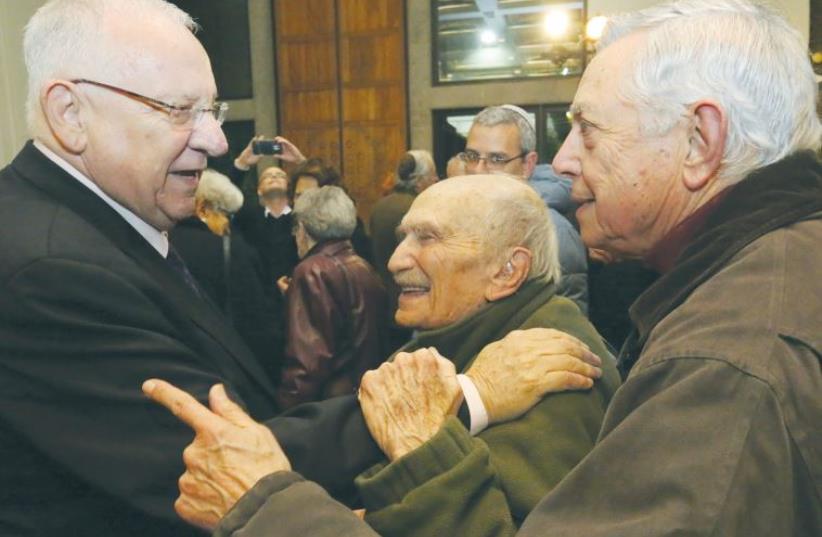 PRESIDENT REUVEN RIVLIN yesterday embraces Prof. Uzi Ornan, 93, who was his Hebrew teacher at the capital’s Gymnasia Rehavia high school. (photo credit: YOSSI ZAMIR)