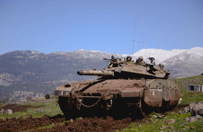 IDF Armored Corps soldiers train on the Golan Heights (photo credit: IDF SPOKESPERSON'S UNIT)
