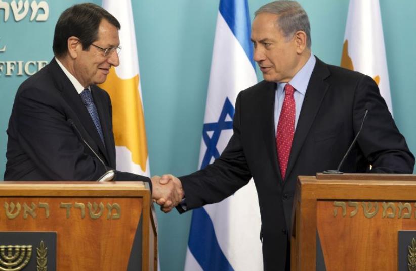 Cyprus President Nicos Anastasiades (L) and Prime Minister Benjamin Netanyahu  (photo credit: REUTERS)