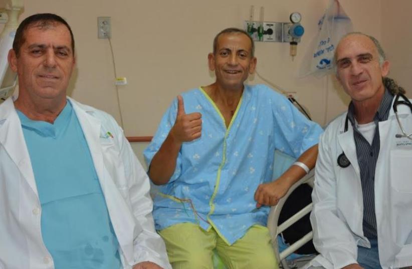 Prof. Aravot (left) and Dr. Ben-Gal (right) with recipient of the Heart Mate 3 (photo credit: Courtesy)
