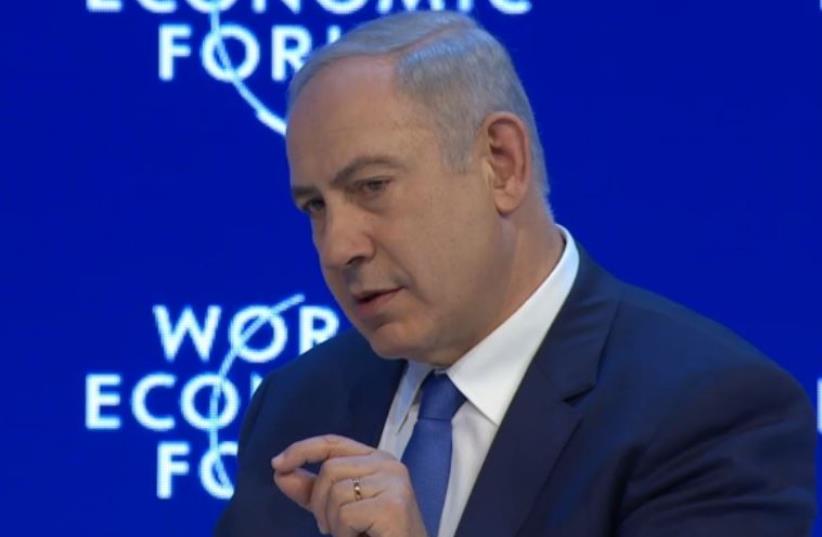 Netanyahu speaks with CNN's Fareed Zakaria in Davos (photo credit: screenshot)