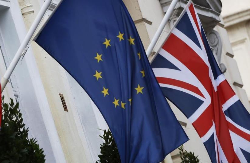 European Union and Union flags fly outside a hotel in London, Britain (photo credit: REUTERS)