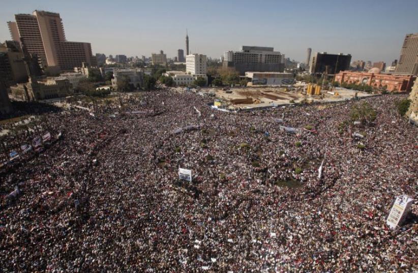 Opposition supporters attend Friday prayer in Tahrir Square in Cairo February 11, 2011 (photo credit: REUTERS)
