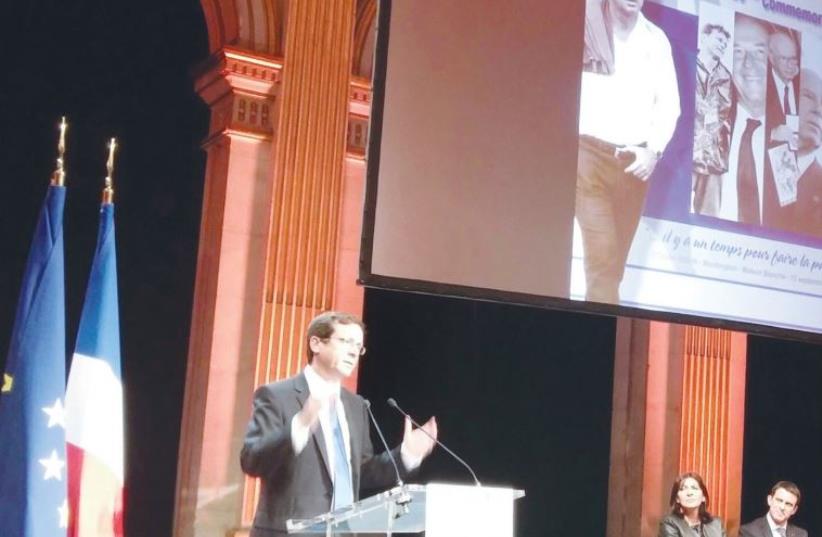 OPPOSITION LEADER Isaac Herzog speaks last night in Paris during commemorations marking 20 years since the assassination of Yitzhak Rabin. (photo credit: RINA BASSIST)