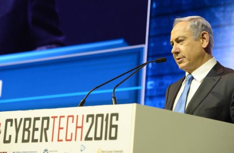 Prime Minister Benjamin Netanyahu addresses the CyberTech conference in Tel Aviv, January 26, 2016 (photo credit: AMOS BEN-GERSHOM/GPO)