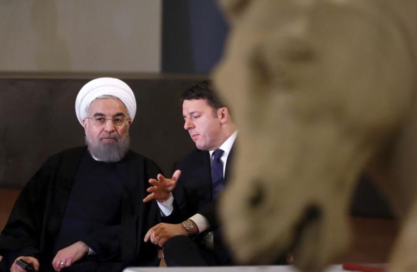 ran President Hassan Rouhani (L) talks with Italian Prime Minister Matteo Renzi at the Campidoglio palace in Rome, Italy, January 25, 2016 (photo credit: REUTERS)