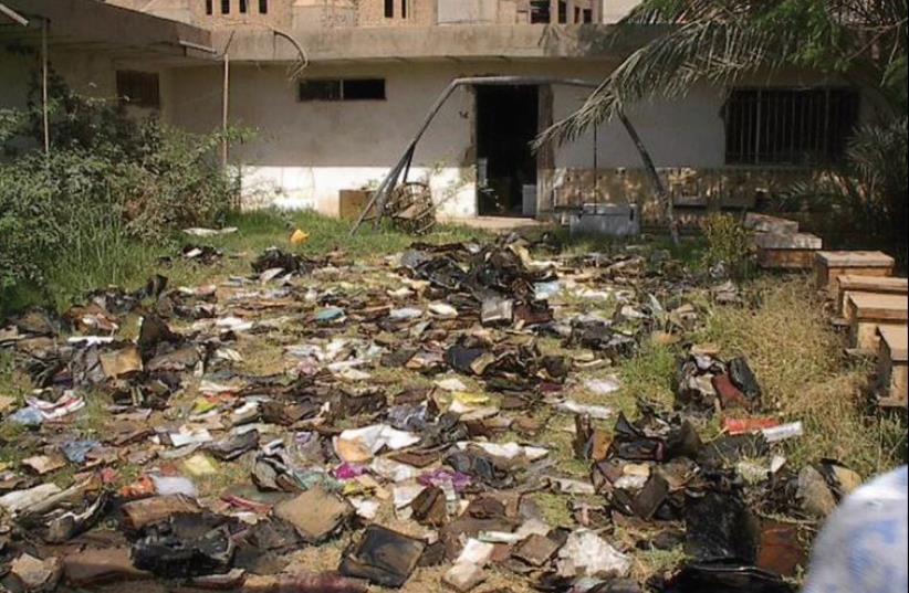 Materials strewn outside the Mukhabarat, Saddam Hussein’s intelligence and secret police hub (photo credit: US NATIONAL ARCHIVES AND RECORDS ADMINISTRATION)