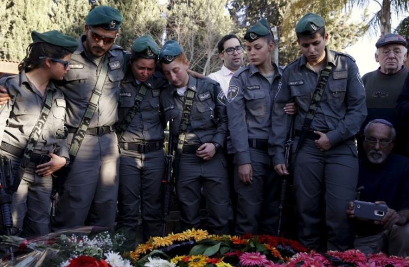 Comrades of Border Policewoman Hadar Cohen mourn during her funeral in Yehud (photo credit: REUTERS)