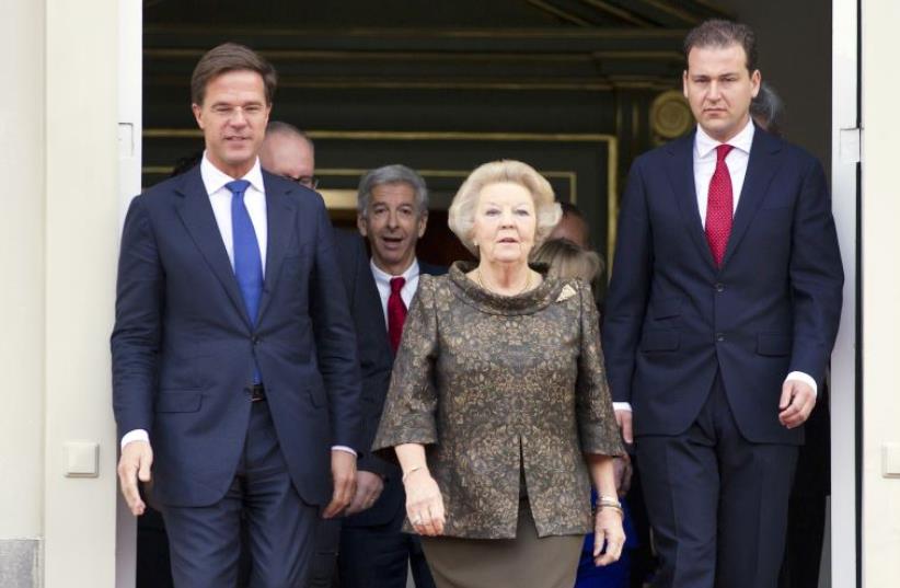 Queen Beatrix of the Netherlands (C), Prime Minister Mark Rutte (L) and Deputy Prime Minister Lodewijk Asscher. (photo credit: MICHAEL KOOREN / REUTERS)