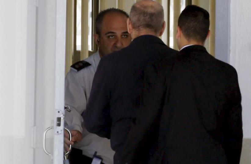 Former prime minister Ehud Olmert (C) enters Ma'asiyahu prison near Ramle (photo credit: REUTERS)