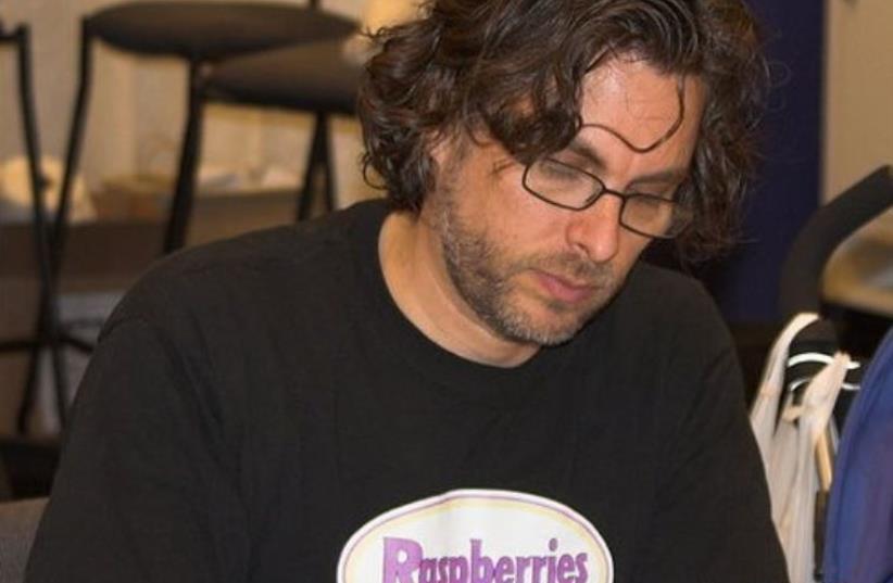 hotograph of author Michael Chabon at a book signing at WonderCon in 2006. (photo credit: CHARLIE REIMAN/WIKIMEDIA COMMONS)