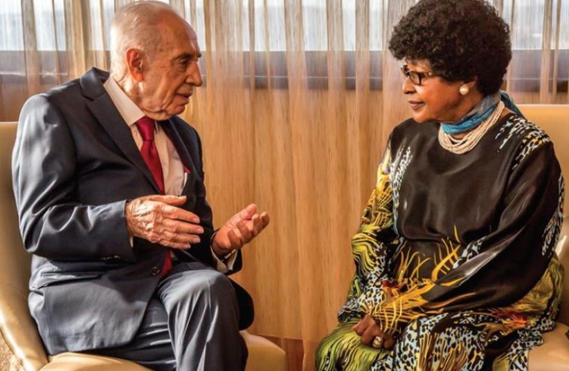 Former president Shimon Peres meets with former South African first lady Winnie Madikizela-Mandela in Johannesburg, February 28, 2016 (photo credit: SHIMON PERES SPOKESMAN)