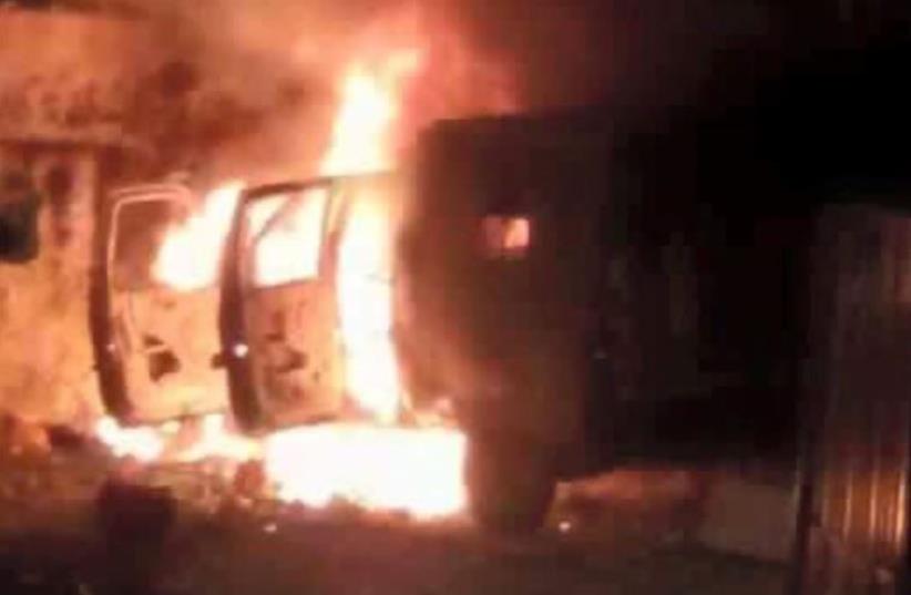 Military vehicle on fire in massive Kalandiya riot (photo credit: Courtesy)