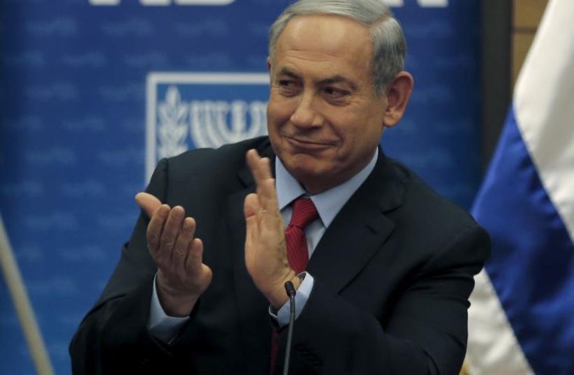 Prime Minister Benjamin Netanyahu attends a Likud party meeting at parliament in Jerusalem (photo credit: REUTERS)