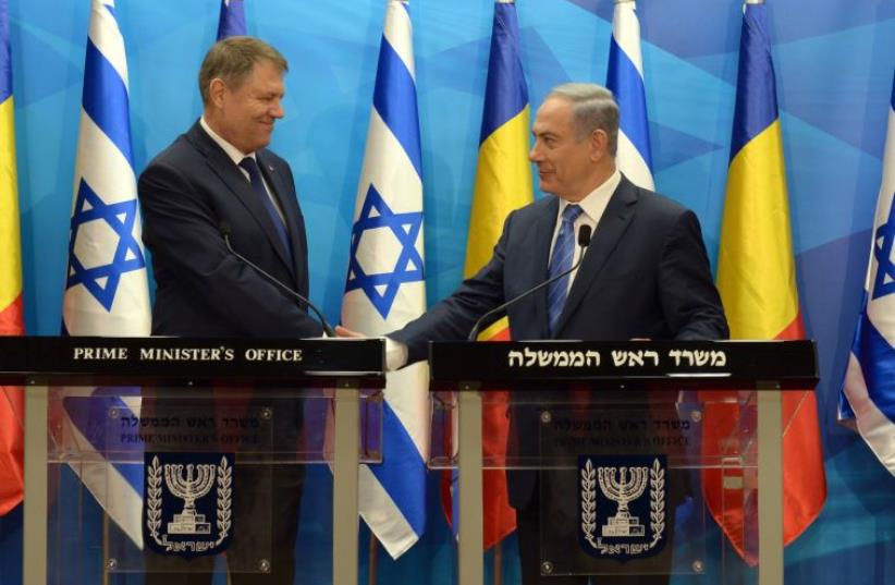 Netanyahu with Romanian President Klaus Werner Lohannis (photo credit: CHAIM TZACH/GPO)