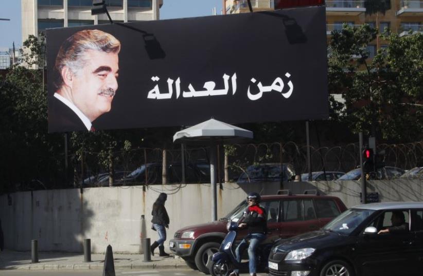 A billboard of former Prime Minister Rafik al-Hariri is displayed along a street in Beirut (photo credit: REUTERS)