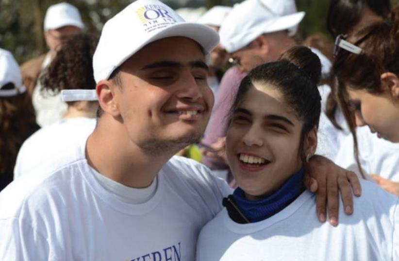 PREAL DAABAH (right) joins with Or Chaim at last year’s Jerusalem Marathon (photo credit: Courtesy)
