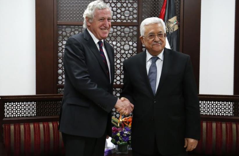 France's Middle East envoy Pierre Vimont (L) meets with Palestinian president Mahmud Abbas on March 15, 2016, in the West Bank city of Ramallah (photo credit: ABBAS MOMANI / AFP)