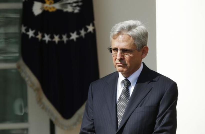 US President Barack Obama (not pictured) announces Judge Merrick Garland (R) of the United States Court of Appeals as his nominee for the US Supreme Court in the Rose Garden of the White House in Washington March 16, 2016. (photo credit: REUTERS)