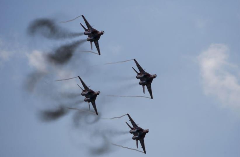 MiG-29 jet fighters of the Russian aerobatic team Strizhi (The Swifts) perform during the MAKS International Aviation and Space Salon in Zhukovsky outside Moscow, Russia, August 30, 2015 (photo credit: REUTERS)