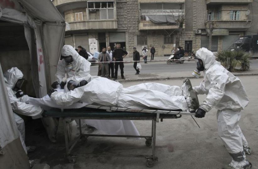 Syrian opposition group carries out chemical weapons drill (illustrative) (photo credit: REUTERS)