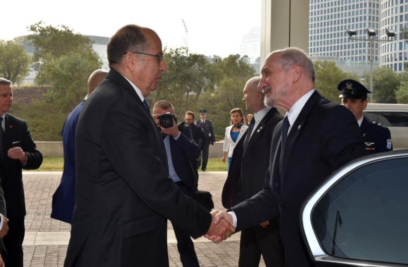 Defense Minister Moshe Ya'alon meets his Polish counterpart,  Antoni Macierewicz, in Tel Aviv on Wednesday. (photo credit: ARIEL HERMONI / DEFENSE MINISTRY)