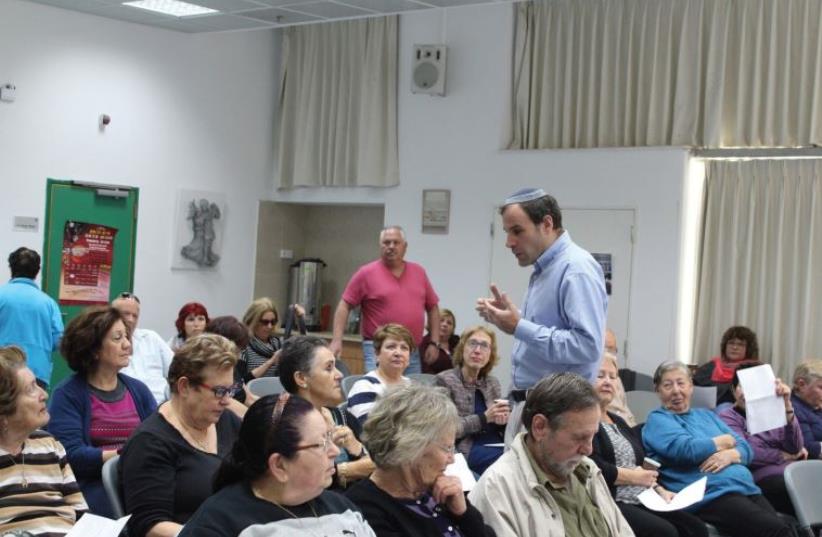THE AUTHOR lecturing to members of a kibbutz in Israel. (photo credit: Courtesy)