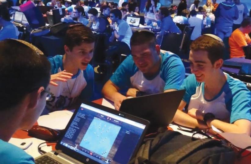 HIGH SCHOOL pupils compete in the finals of the National Cyber Conference in Tel Aviv, April 12, 2016 (photo credit: (AICF/CHRIS LEE))