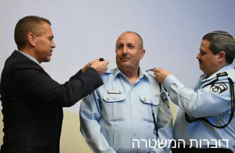 Gilad Erdan (left), Jamal Hachrush (center), and  Roni Alsheich (photo credit: POLICE SPOKESPERSON'S UNIT)