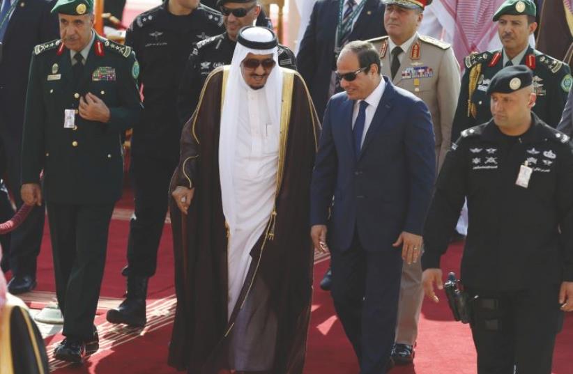 SAUDI KING Salman bin Abdulaziz, left, walks with Egypt’s President Abdel Fattah al-Sisi in Riyadh last year. (photo credit: REUTERS/FAISAL AL NASSER)