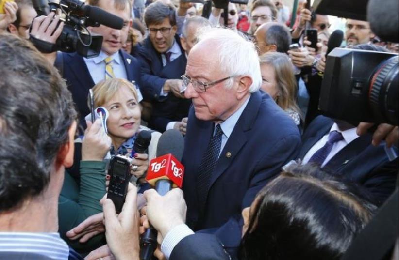 US Democratic presidential candidate Bernie Sanders speaks with media and supporters during his visit to the Vatican , April 15, 2016.  (photo credit: REUTERS)