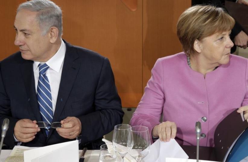 Prime Minister Benjamin Netanyahu (L) and German Chancellor Angela Merkel (photo credit: REUTERS)