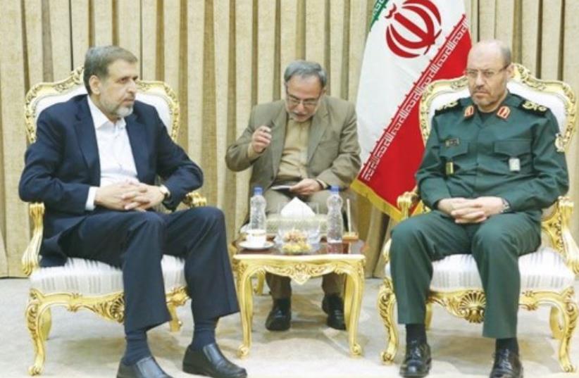 ISLAMIC JIHAD leader Ramadan Shalah (left) meets with Iranian Defense Minister Hossein Dehqan in Tehran on Tuesday (photo credit: IRANIAN MEDIA)