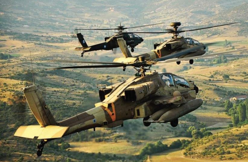 An Israel Air Force Apache helicopter lands across from a Greek mountain range during a joint Israel-Greece exercise with the Hellenic Air Force in October 2011 (photo credit: IAF)