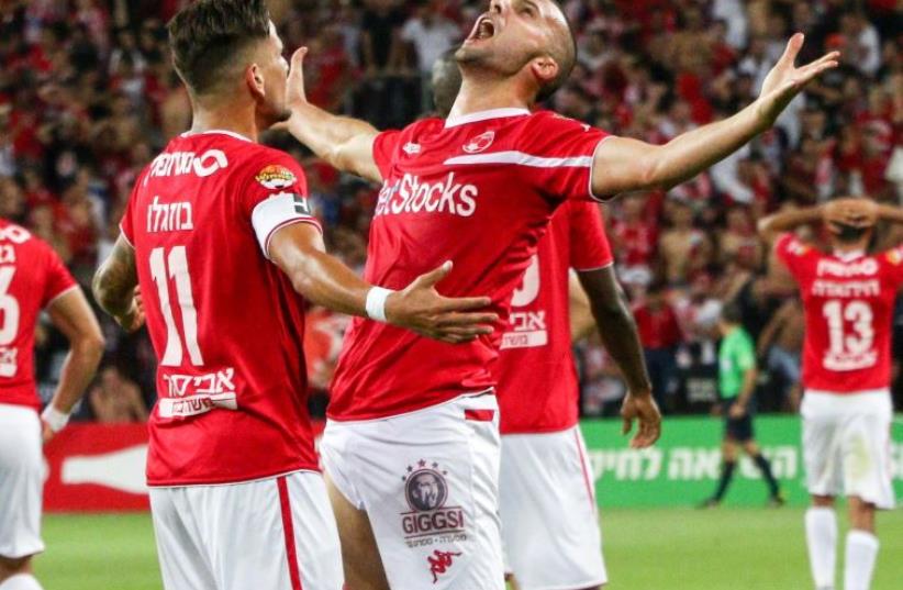 Hapoel Beersheba striker Ben Sahar (right) and teammate Maor Buzaglo, who both scored last night, celebrate the club's first Premier League championship in 40 years. (photo credit: DANNY MARON)