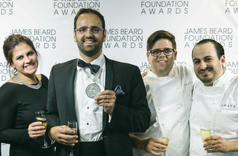 Alon Shaya (center) celebrates his win at the James Beard awards ceremony in Chicago earlier this month. (photo credit: GALDONES PHOTOGRAPHY/JBF)