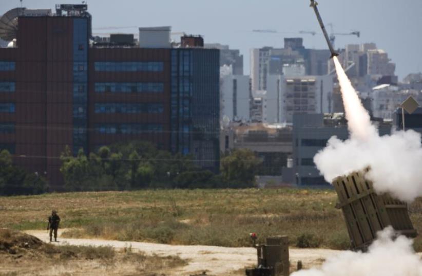 An Iron Dome launcher fires an interceptor rocket in southern Israel (photo credit: REUTERS)