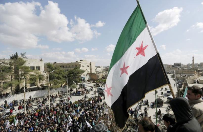 anti-government protest in Maarat al-Numan, Syria (photo credit: REUTERS)