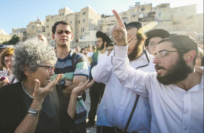 Conflict at the Kotel. Members of the Reform Movement clash with Orthodox worshipers at the Western Wall last week (photo credit: MARC ISRAEL SELLEM)