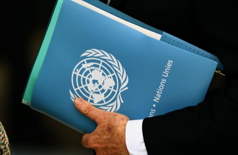 Envoy holds folder at the 31st Session of the Human Rights Council at the U.N. European headquarters in Geneva, Switzerland (photo credit: REUTERS)
