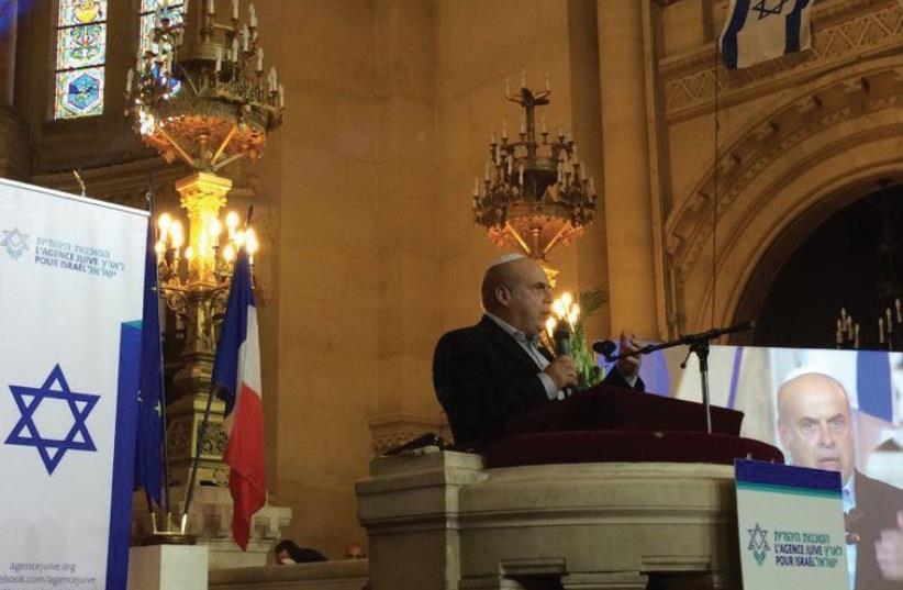 JAFI head Natan Sharansky wishes success yesterday in Paris to French Jews about to make aliya. (photo credit: JAFI)