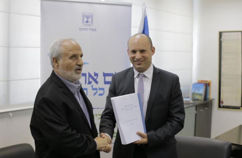 Erez Biton presents the recommendations of the Biton Committee to Education Minister Naftali Bennett in Tel Aviv on Thursday (photo credit: DANIEL BROWN)