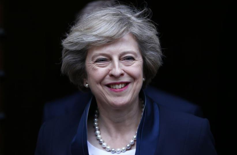 Theresa May emerges to speak to reporters after being confirmed as the leader of the Conservative Party.. (photo credit: REUTERS)