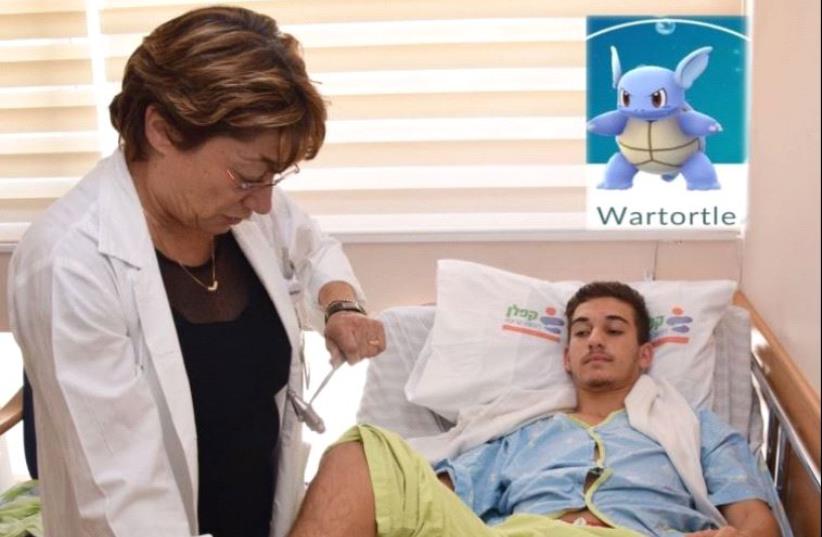 Assaf Ben Guzi is examined by Dr. Ronit Gilad, head of the Department of Neurology at Kaplan. Ben Guzi nearly drowned trying to catch a pokemon. (photo credit: KAPLAN MEDICAL CENTER)