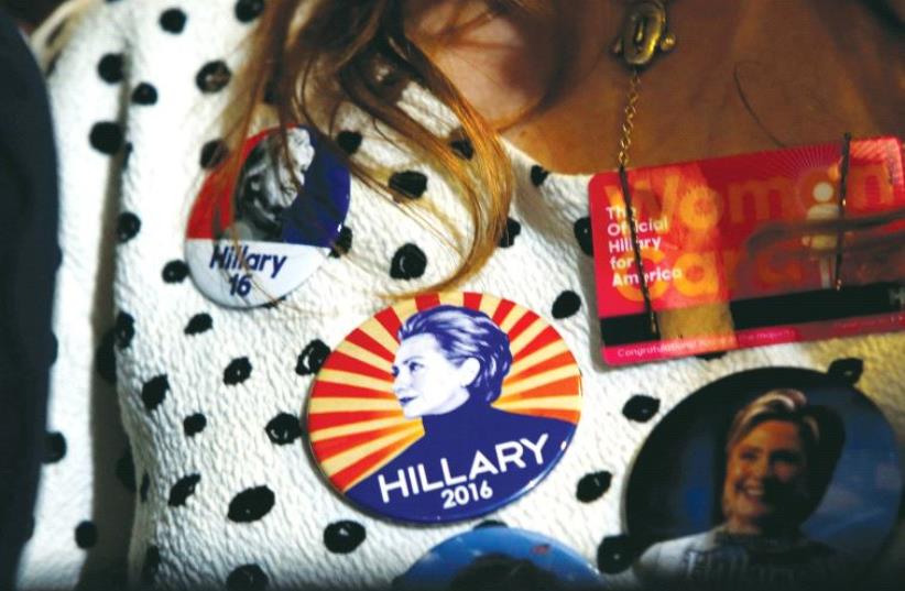 A SUPPORTER wears Democratic US presidential nominee Hillary Clinton buttons during a Clinton campaign rally in Las Vegas, Nevada, on August 4. (photo credit: REUTERS)