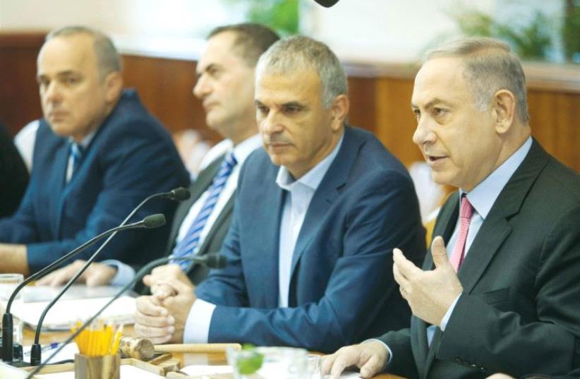PRIME MINISTER Benjamin Netanyahu praises the new budget before the cabinet debate yesterday. (photo credit: REUTERS)