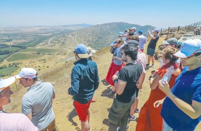 CIJO MISSION PARTICIPANTS view Syria from the Golan Heights, where they heard explosions from the nearby civil war two weeks ago. (photo credit: Courtesy)