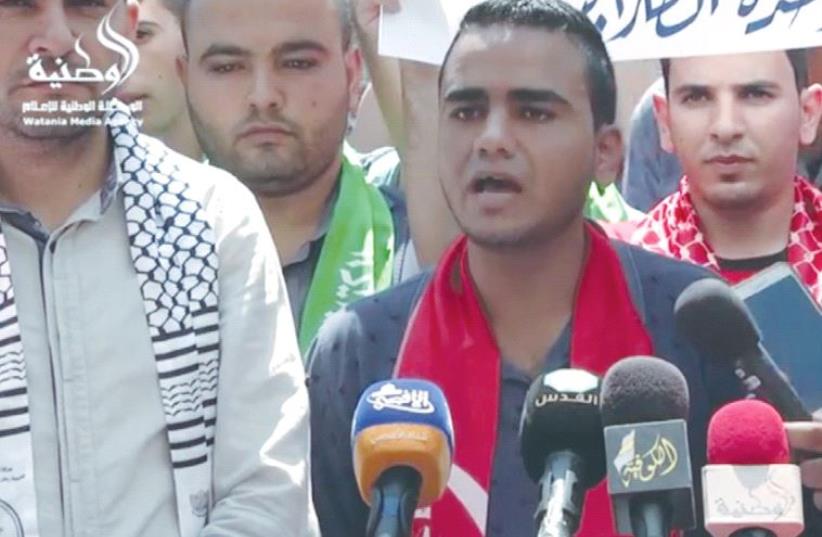 Mahmoud al-Tramasi, a student leader at Al-Aksa University in Gaza City, speaks at a rally outside the school (photo credit: screenshot)