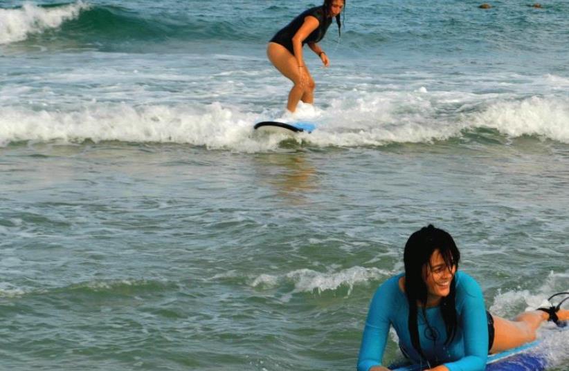 Maya Surf students practice catching a wave (photo credit: INBAL AHARONI)