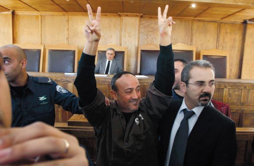 Marwan Barghouti, seen here at the Jerusalem Magistrates’ Court in 2012, is currently serving five life sentences for murder (photo credit: REUTERS)
